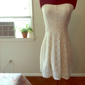 Sleeveless white dress.